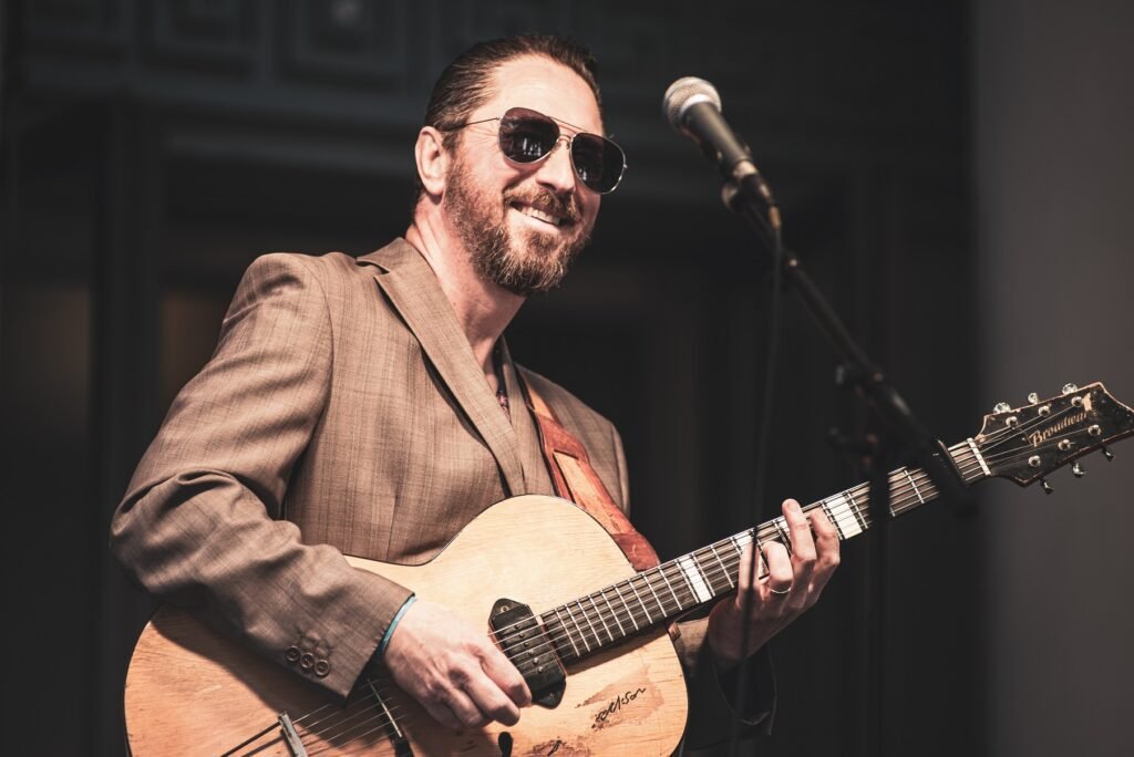 Chris Corcoran, the Brit King of Jump Blues, playing guitar live on stage